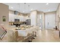 Modern kitchen with island and stainless steel appliances at 7571 Sunny Dreams Ln, Kissimmee, FL 34747