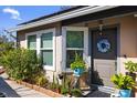 House entrance with landscaping and wreath at 132 Meadow Blvd, Sanford, FL 32771