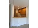 Kitchen with breakfast bar and ample cabinet space at 3514 Victoria Pines Dr # 148, Orlando, FL 32829