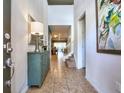 Bright and spacious entryway with a teal cabinet at 8887 Qin Loop, Kissimmee, FL 34747