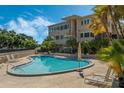 Inviting community swimming pool with lounge chairs at 311 E Morse Blvd # 7-2, Winter Park, FL 32789