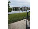 View of a lake and condo building from a patio at 5525 Pga Blvd # 4614, Orlando, FL 32839