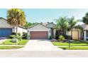 One-story house with attached garage and manicured landscaping at 333 Navarra Ln, Davenport, FL 33837