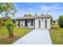Newly renovated home with a freshly paved driveway at 143 Bob Thomas Cir, Sanford, FL 32771