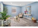 Light and airy living room with stylish decor and hardwood floors at 143 Bob Thomas Cir, Sanford, FL 32771