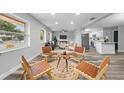 Open concept living room, featuring modern decor and a view into the kitchen at 274 N Ranger Blvd, Winter Park, FL 32792