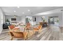 Open concept living room with modern furniture and a view of the kitchen at 274 N Ranger Blvd, Winter Park, FL 32792