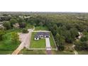 Aerial view of a modern farmhouse with a fenced yard at 3429 Boggy Creek Rd, Kissimmee, FL 34744