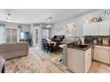 Open kitchen with granite countertops and island at 618 Brunello Dr, Davenport, FL 33897