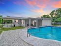 Inviting backyard with a refreshing pool and covered patio at 1567 Fort Smith Blvd, Deltona, FL 32725
