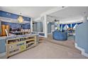 Open living area with high ceilings, stylish furniture and a view to the dining room at 9 Stone Gate N, Longwood, FL 32779