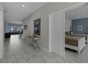 Elegant marble hallway with access to bedrooms and living areas at 4637 Target Blvd, Kissimmee, FL 34746