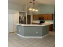 Kitchen with stainless steel appliances and an island at 3501 Beau Chene Dr, Kissimmee, FL 34746