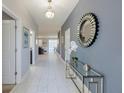Bright entryway with tile floors and modern decor at 9076 Hazard St, Davenport, FL 33896