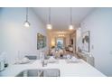 Open concept kitchen with island and dining area at 387 Famagusta Dr, Davenport, FL 33896