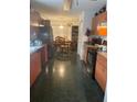 Eat-in kitchen with wood cabinets and dark tile floor at 2135 Sw 156Th Pl, Ocala, FL 34473