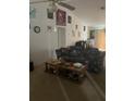 Living room with floral sofa and wood coffee table at 2135 Sw 156Th Pl, Ocala, FL 34473
