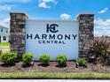 Harmony Central community entrance sign with stone pillars and landscaping at 4410 Sagefield Dr, St Cloud, FL 34773