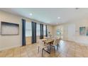 Bright dining room with tile floors and a table for six at 601 Lasso Dr, Kissimmee, FL 34747