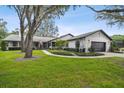 Charming single story home with a lush green lawn at 4600 Nebraska Ave, Sanford, FL 32771