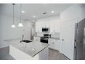 Modern kitchen with white cabinets and granite countertops at 2659 Trafalgar Blvd, Kissimmee, FL 34758