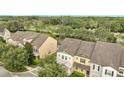 Community overview showcasing townhomes with lush greenery at 5102 Caspian St, Saint Cloud, FL 34771