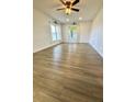 Spacious living room with wood-look flooring at 5135 Warrior Ln, Kissimmee, FL 34746