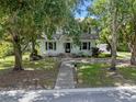 Front view of a two-story house with a walkway and mailbox at 1803 E Kaley Ave, Orlando, FL 32806