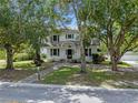 Two-story house with a large front yard and mature trees at 1803 E Kaley Ave, Orlando, FL 32806