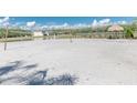 Beach volleyball court near a lake at 4963 Pall Mall E St, Kissimmee, FL 34758