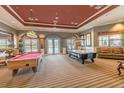 Game room with pool table and air hockey at 4963 Pall Mall E St, Kissimmee, FL 34758