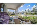 Relaxing front porch with seating, a view of the street, and neighborhood at 1105 Pacific Dunes Ct, Daytona Beach, FL 32124