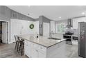 Renovated kitchen featuring granite island and stainless steel appliances at 523 Fern St, Oviedo, FL 32765