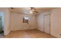 Small bedroom with tiled floors and a ceiling fan at 1440 Walker Rd, Lakeland, FL 33810