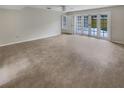 Bright living room with French doors leading to patio at 4934 Samoa Cir # 7, Orlando, FL 32808