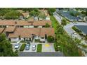 Aerial view showcasing a condo building and surrounding landscape at 2384 Sun Valley Cir, Winter Park, FL 32792