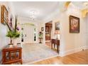 Elegant entryway with hardwood floors and a chandelier at 1650 Lakehurst Ave, Winter Park, FL 32789