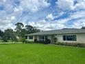 Ranch style home with a large green lawn at 349 Bodie St, Longwood, FL 32750