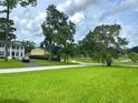 Residential street with mature trees and spacious yards at 349 Bodie St, Longwood, FL 32750