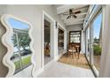Sunroom with access to other rooms and lake view at 151 N Orlando Ave # 131, Winter Park, FL 32789