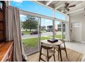 Sunroom features a table, chairs, and lake view at 151 N Orlando Ave # 131, Winter Park, FL 32789