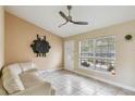 Living room with light walls and a comfortable couch at 501 N Normandale Ave, Orlando, FL 32835