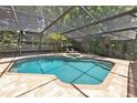 Screened pool and spa surrounded by lush landscaping at 615 Crosby Dr, Altamonte Springs, FL 32714