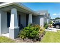 House exterior featuring a covered porch and landscaping at 3882 Willow Ridge Dr, Lakeland, FL 33810