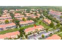 Aerial view of townhome community, highlighting a specific property and its surroundings at 3004 White Orchid Rd, Kissimmee, FL 34747
