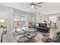 Spacious living room with modern furniture and large windows at 1585 Mulligan Blvd, Davenport, FL 33896