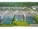 Aerial view of houses with pools and lush landscaping at 311 Marcello Blvd, Kissimmee, FL 34746