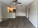 Spacious living area with new flooring and access to the kitchen at 5164 Conroy Rd # 1514, Orlando, FL 32811