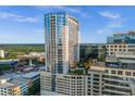 High-rise building with a rooftop pool and city views at 155 S Court Ave # 2208, Orlando, FL 32801