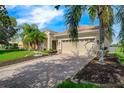 House exterior with driveway and palm trees at 3404 Great Pond Dr, Kissimmee, FL 34746